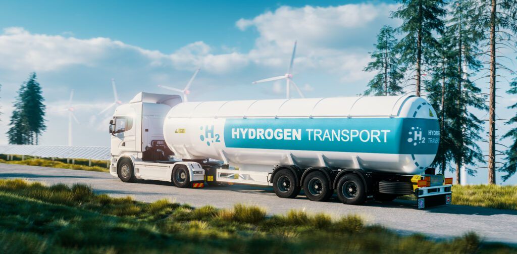 hydrogen gas transportation concept truck with gas tank trailer fresh nature with solar panel wind turbine background 3d rendering scaled